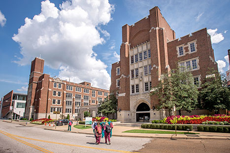 Photo of students walking on campus. Links to Closely Held Business Stock
