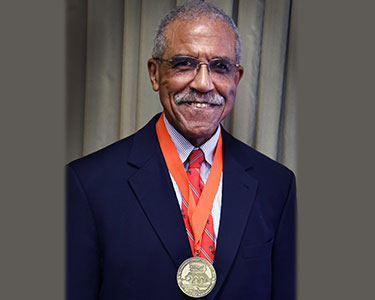 Photo of a person at a society event Photo of a person at a society event