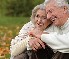 Photo of a man and woman smiling for a picture. Link to Life Stage Gift Planner Over Age 65 Situations.